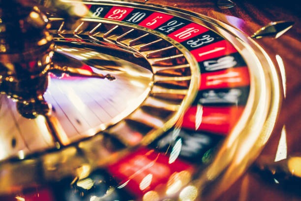 Roulette table with wheel and betting grid